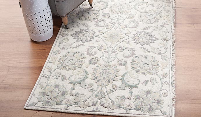 A contemporary rug placed on the wooden floor