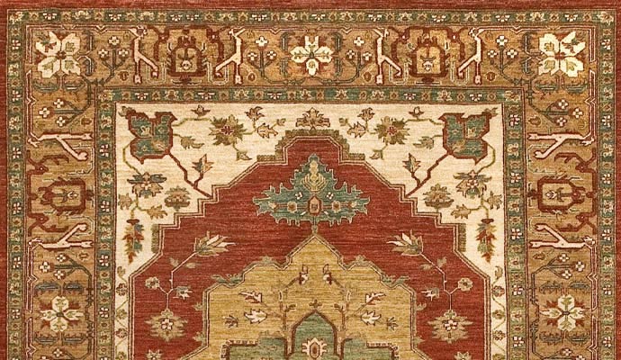 A red rug has a stepped medallion.