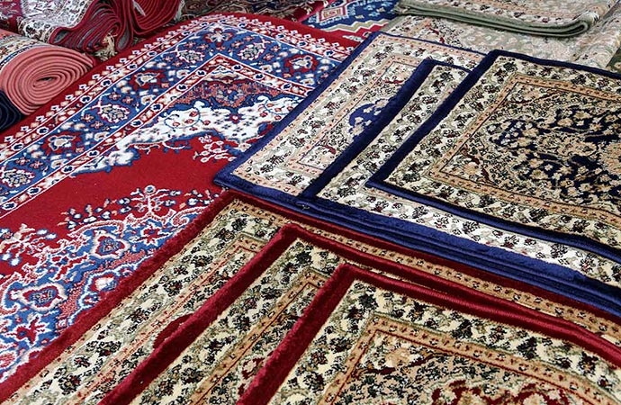 Colorful rugs in different size stacked