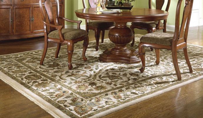 Elegant European rug placed under a dining table in a stylish dining room