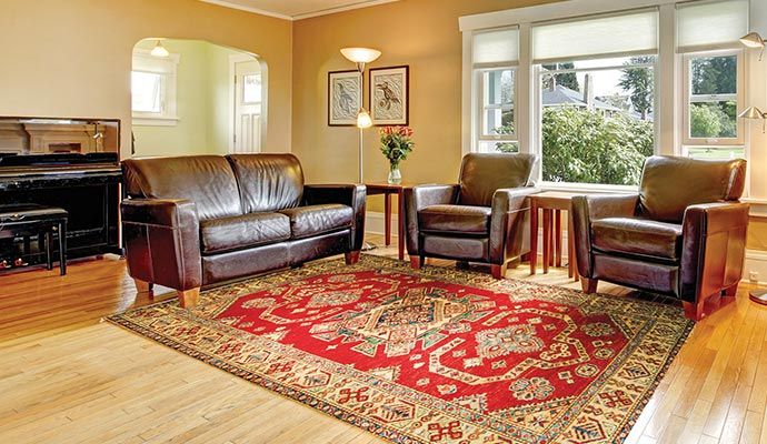 Oriental rug placed in a modern living room with elegant furniture and stylish decor