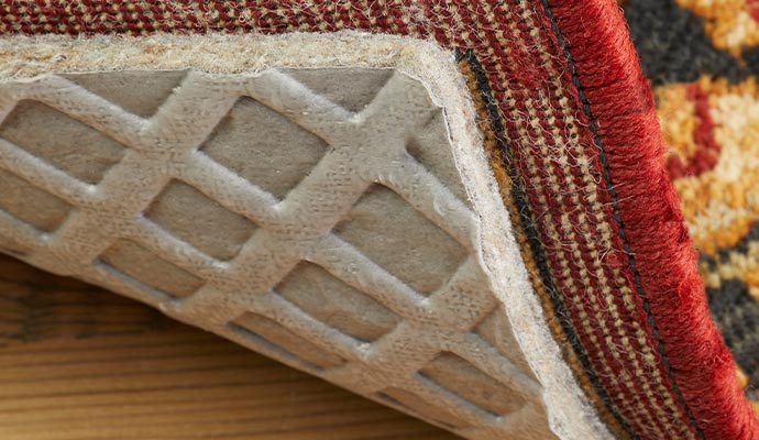 A woven rug on non slip rug pad