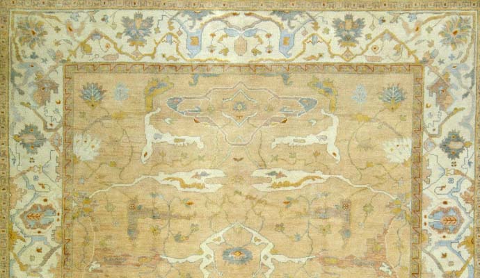 Smyrna Oushak collection rug with soft beige and light blue floral patterns