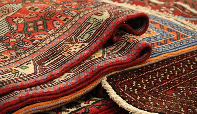 Stack of folded oriental rugs